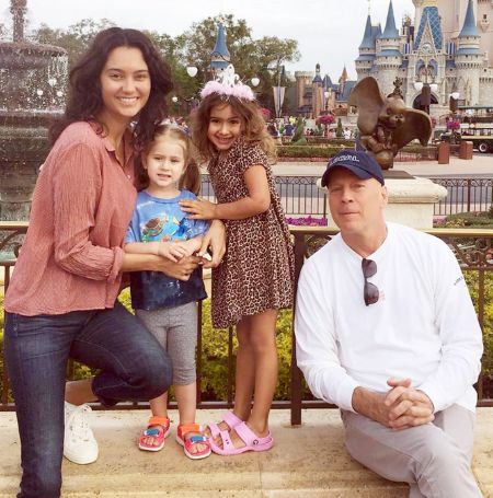 Evelyn with her family in Disneyland Image Source: People